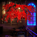 Decorbites red metal island ceiling light with vibrant red artificial flowers and black diamond cage industrial suspension lamp