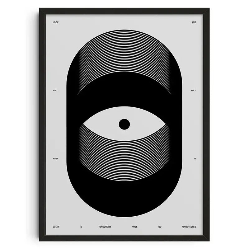 Black-framed decorbites™ retro abstract canvas print with stylized white eye design on light gray background for home décor