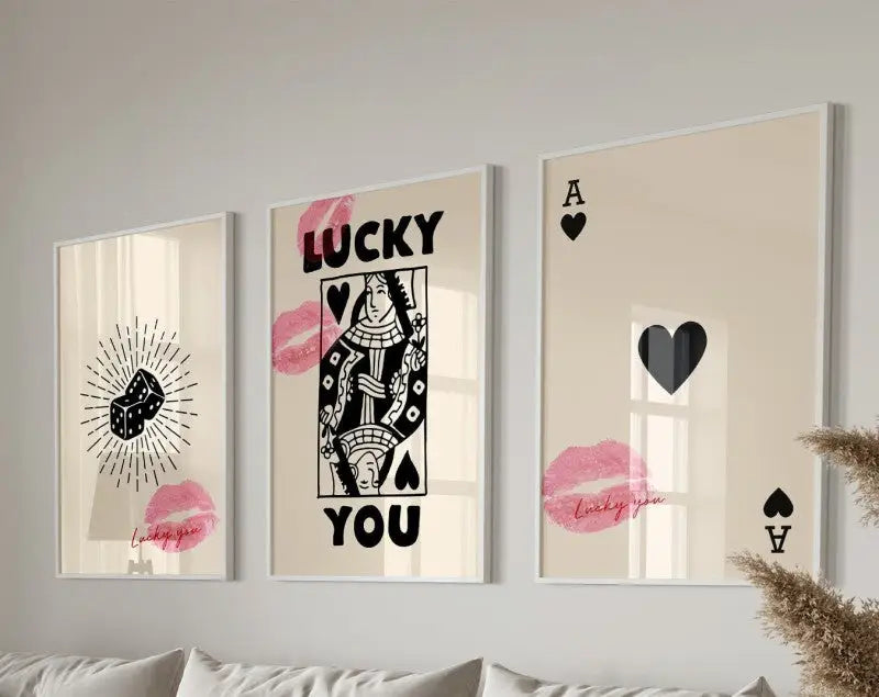 Three framed decorbites™ retro wall art posters featuring black and pink playing cards dice and lucky you text designs