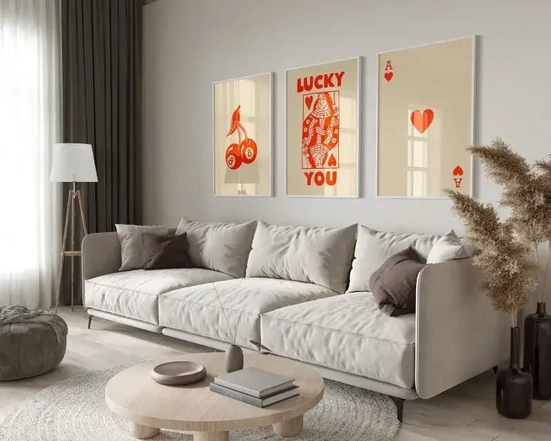 Beige sofa with gray and brown throw pillows displayed with decorbites™ retro wall art posters set queen of hearts