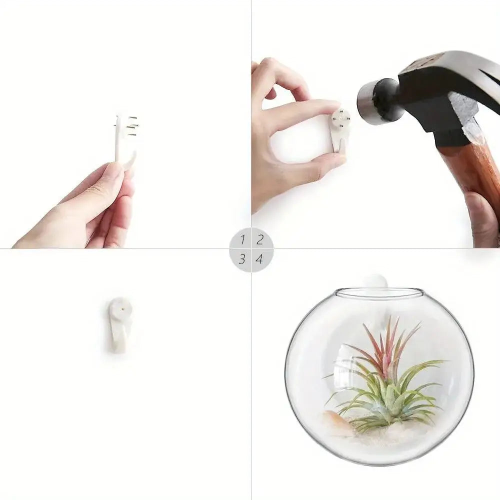 White plastic wall hook with circular base and three prongs for securing the decorbites™ glass terrarium set