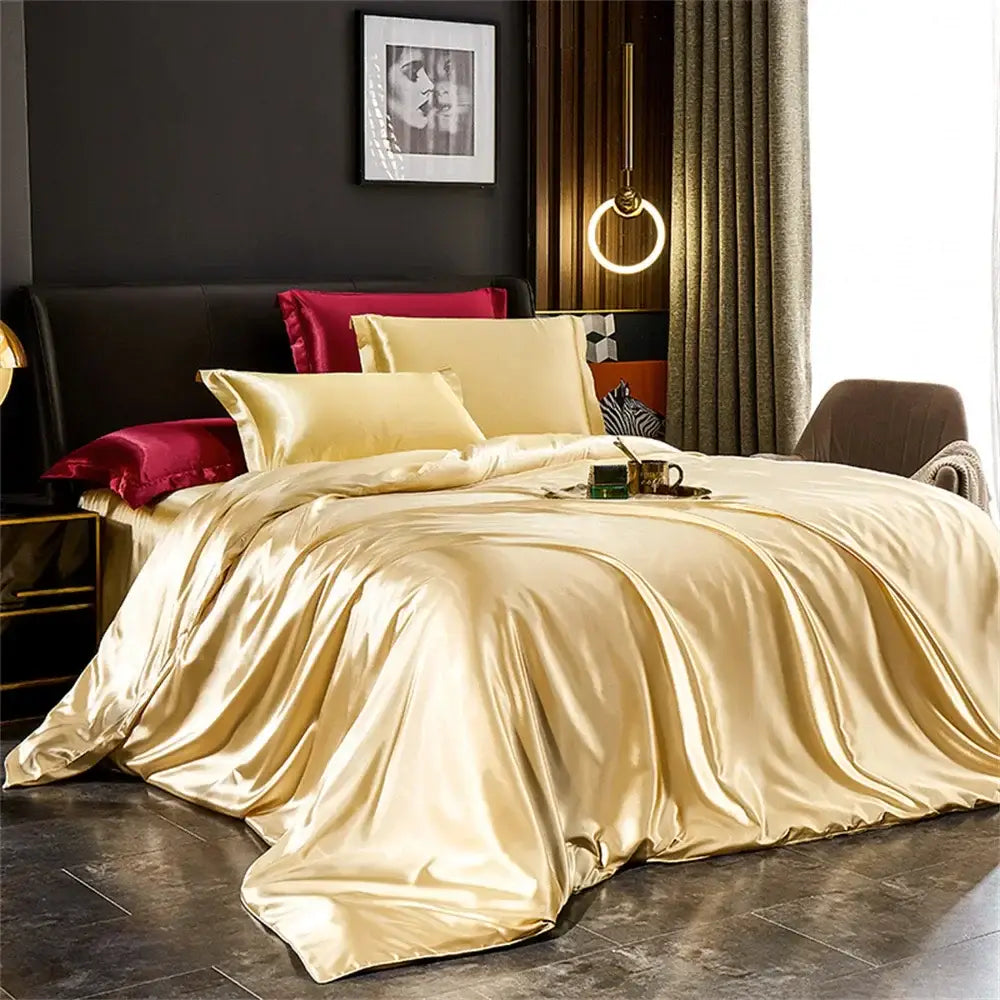 Glossy gold satin duvet cover set with matching cream and burgundy pillows from decorbites silk bedding set