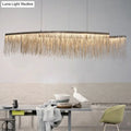 Modern gold-toned metallic tassel chain led pendant light with cascading fringe design for post-modern dining rooms