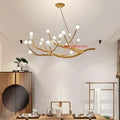 Golden iron tree branch chandelier with multiple spherical bulbs from decorbites simulation bubble design