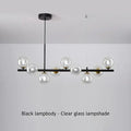 Black metal decorbites™ sleek glass ball chandelier with clear glass globe shades for dining room lighting