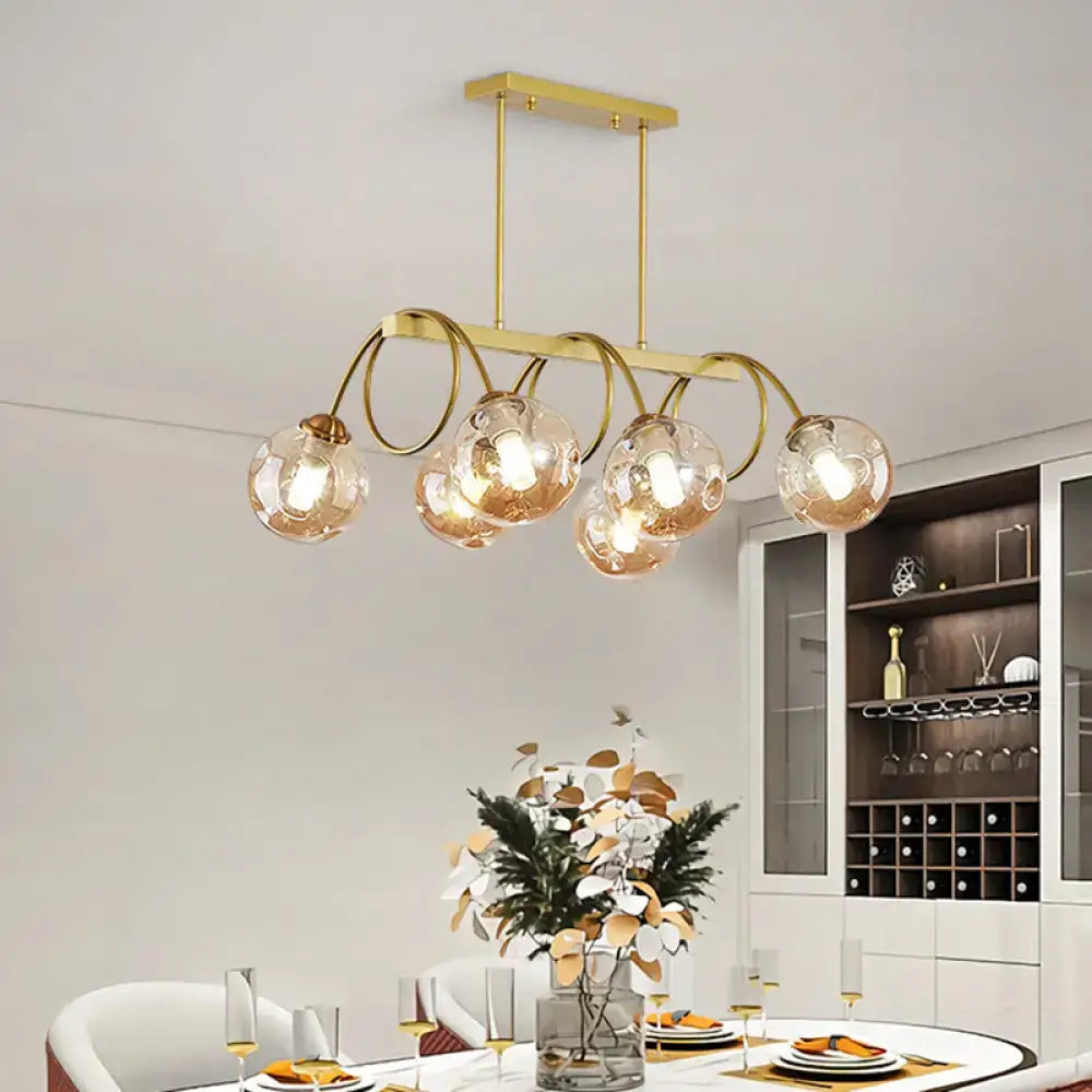 DecorBites™ Sleek Gold Spiral Island Light - Post-Modern Metal Ceiling Hang Lamp with Ball Glass Shade