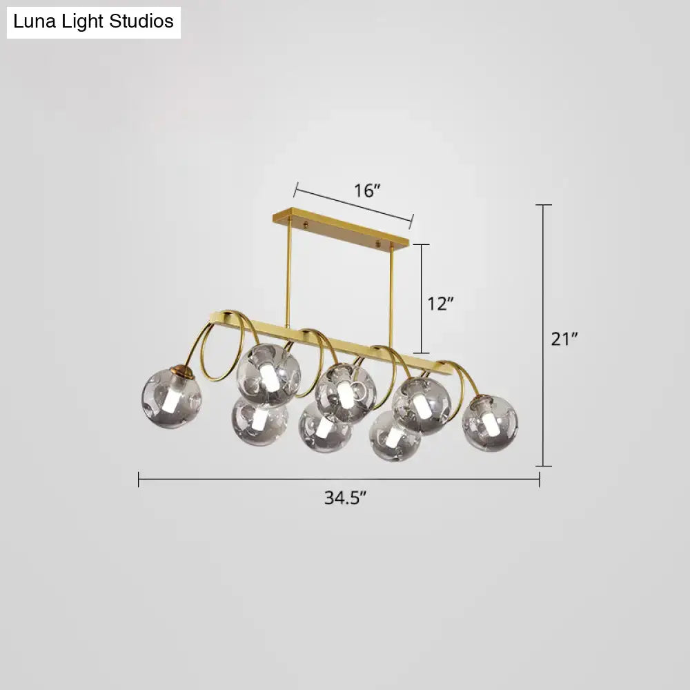 DecorBites™ Sleek Gold Spiral Island Light - Post-Modern Metal Ceiling Hang Lamp with Ball Glass Shade