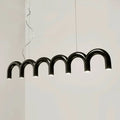 Black arched pendant light with warm glow in decorbites™ sleek u-shaped chandelier for modern bedroom and kitchen use