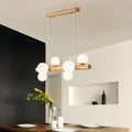 Modern wooden ceiling light with cream glass shade featuring frosted globe bulbs for dining room island chandelier