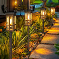 Decorbites™ solar pathway lights bronze finished with clear glass panels and warm yellow light for outdoor use