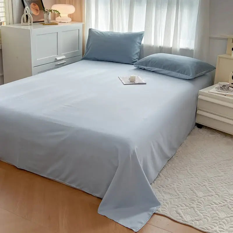 Light blue solid color brush fabric bed sheet and pillowcases in decorbites duvet cover bedding set 4 pieces neatly arranged