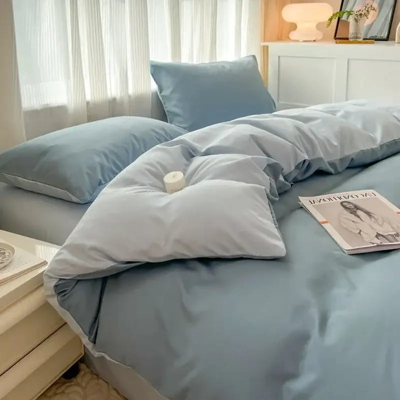 Soft blue satin duvet cover set with matching pillows featuring solid color brush fabric and subtle sheen by decorbites