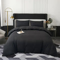 Black satin duvet cover set by decorbites with matching pillowcases featuring smooth luxurious texture and elegant drape