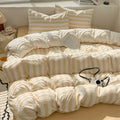 Cream and beige striped quilt set with pillowcases and bed sheet featuring a soft puffy texture by decorbites