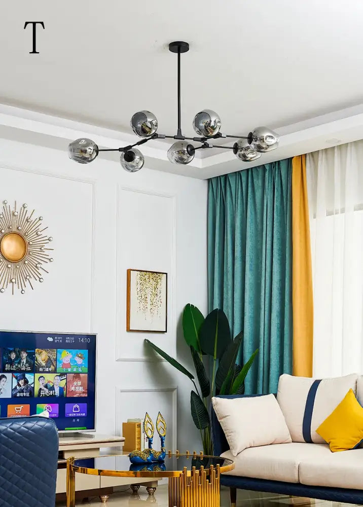 Modern chrome-finished stylish nordic chandelier with spherical glass globes for dining living room by DecorBites