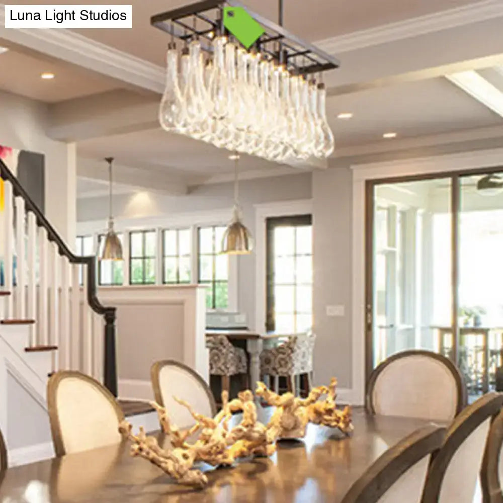 Decorbites traditional black island pendant light with clear glass rectangles hanging above dining table