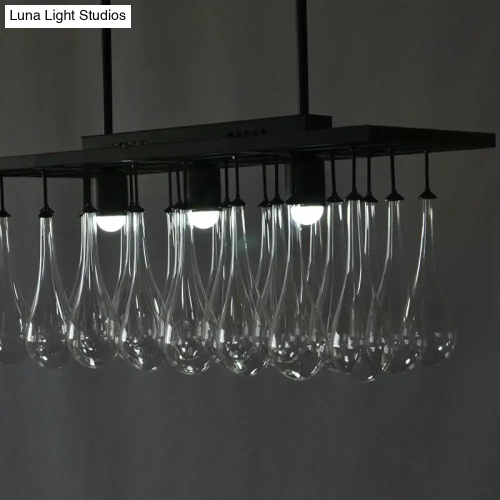 Modern black metal island pendant light with clear glass teardrop pendant lights for warm white illumination