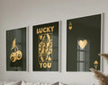 Three framed black and gold playing card wall art pieces featuring cherries queen with lucky you and ace of hearts trendy retro wall decor