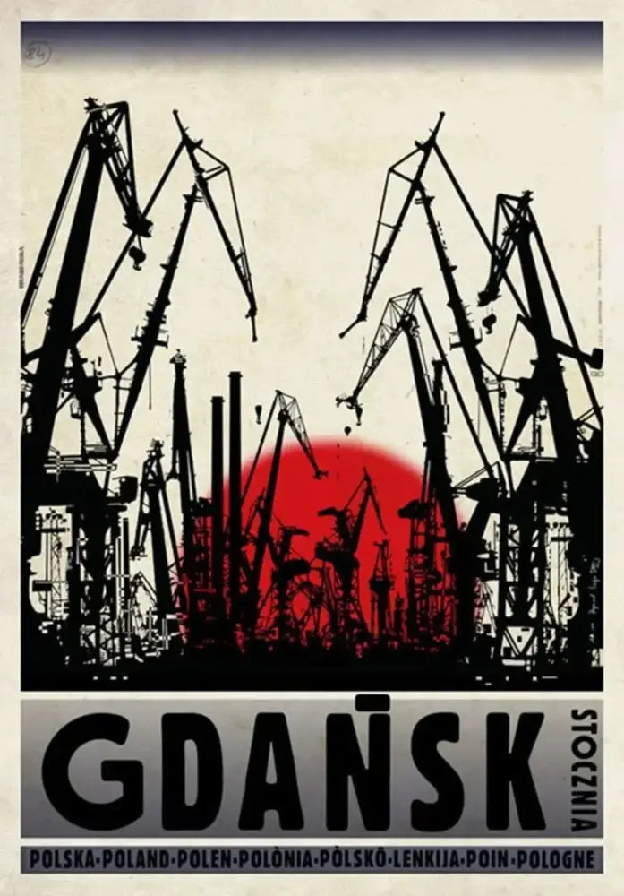 Black silhouette of industrial cranes against red sun on beige sky vintage poland city poster canvas print