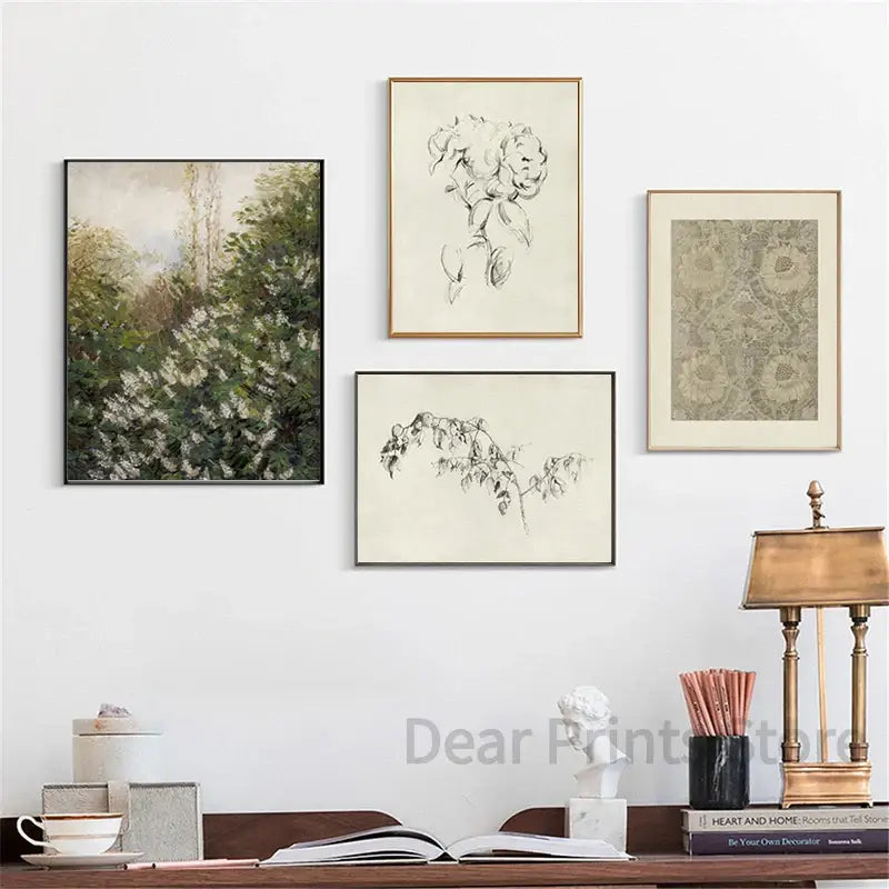 Four framed art prints including a green vintage summer landscape canvas print and black and white botanical sketches