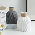 Two DecorBites™ water ripple plastic vases in matte gray and white with twine bands in modern Nordic style