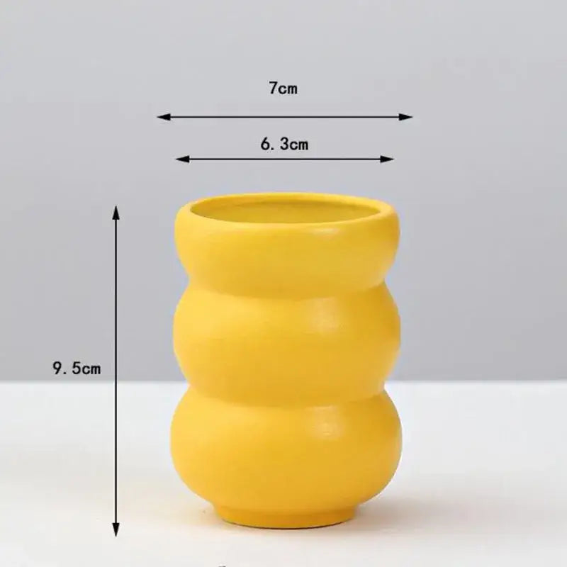 DecorBites™ yellow porcelain flower vase with segmented bumpy design for elegant home decor display