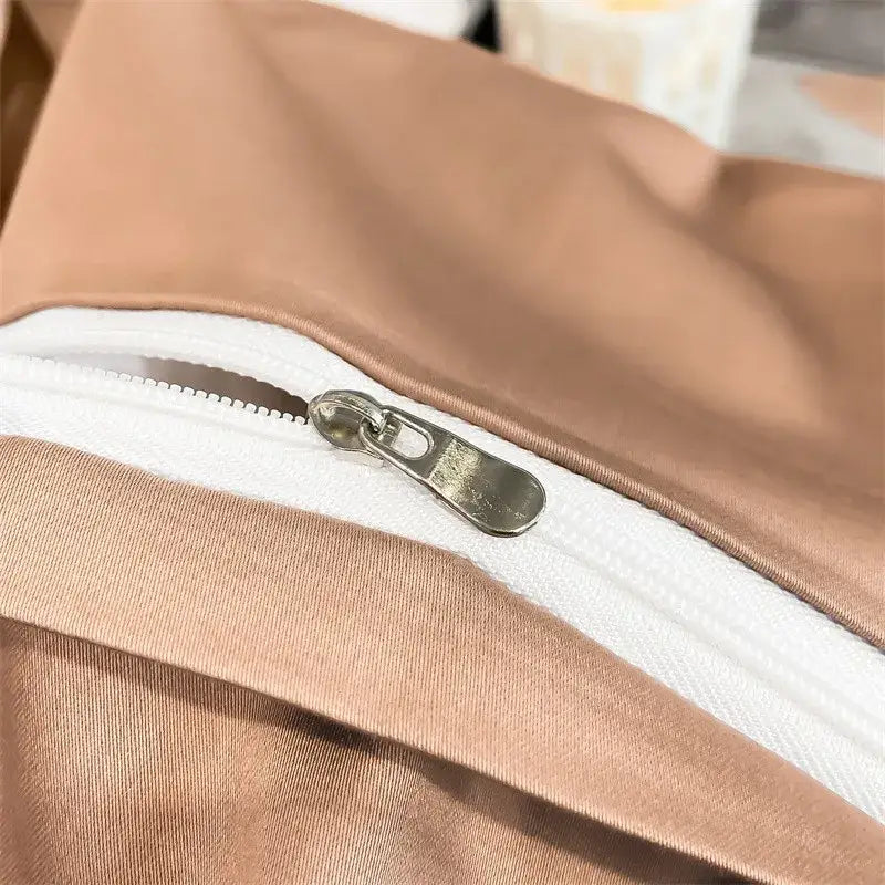 A sleek metallic zipper with silver pull on taupe fitted sheet from DecorBites 1000TC Egyptian cotton duvet cover set