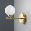 Elegant gold and ivory glass wall sconce for bedroom light