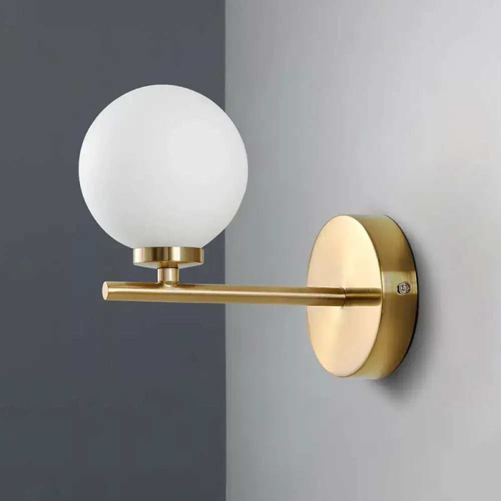 Elegant gold and ivory glass wall sconce for bedroom light