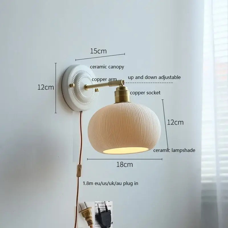 Fluted cream ceramic wall lamp with brass accents – bathroom light