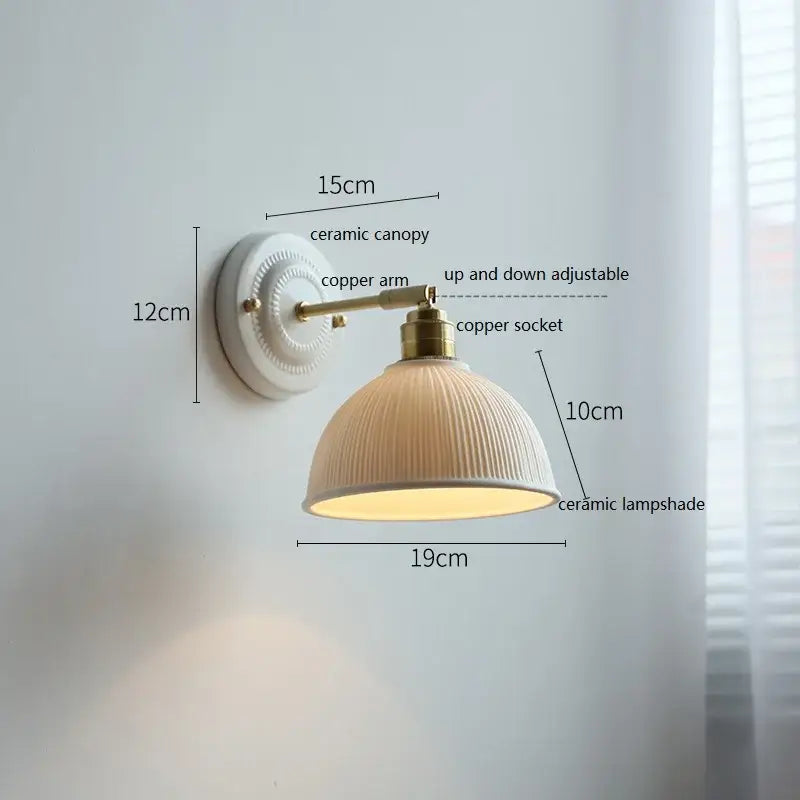 Fluted cream ceramic wall lamp with brass accents – bathroom light