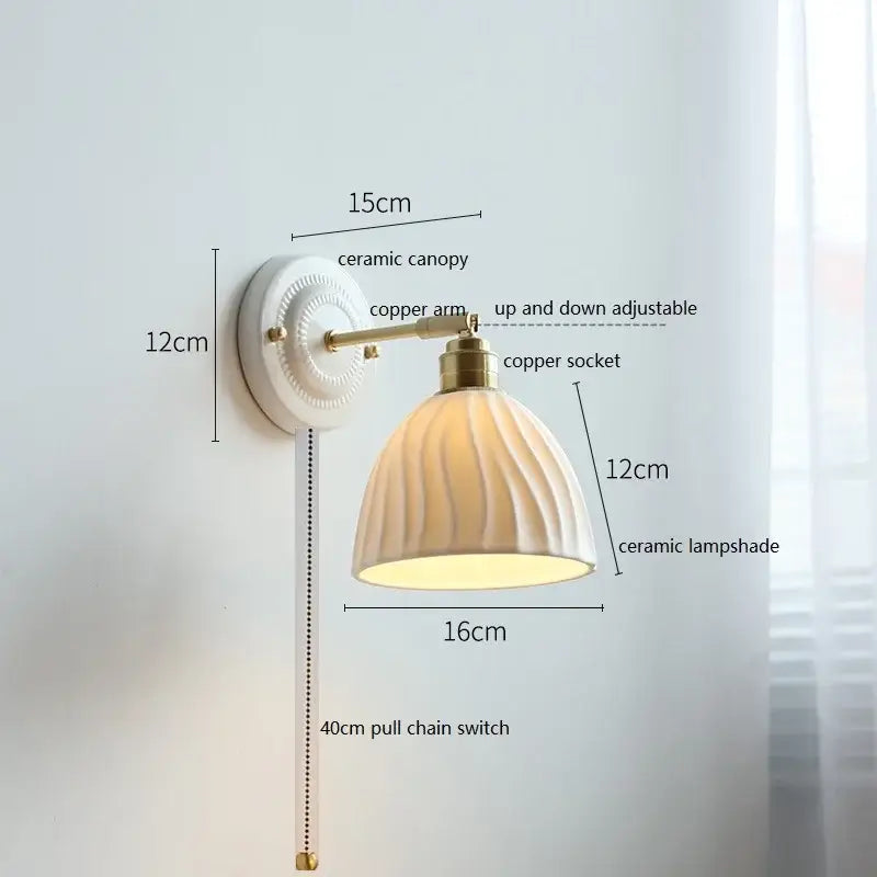 Fluted cream ceramic wall lamp with brass accents – bathroom light