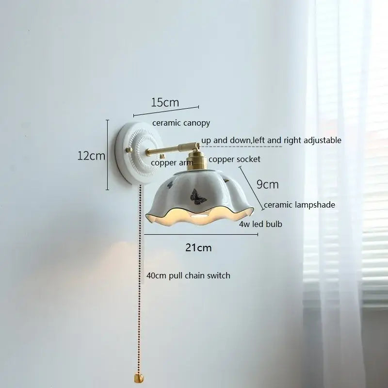 Fluted cream ceramic wall lamp with brass accents – bathroom light