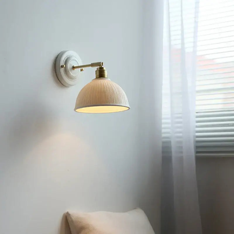 Fluted cream ceramic wall lamp with brass accents – bathroom light