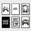 Set of six black and white game controller wall art prints with splattered ink designs from DecorBites™