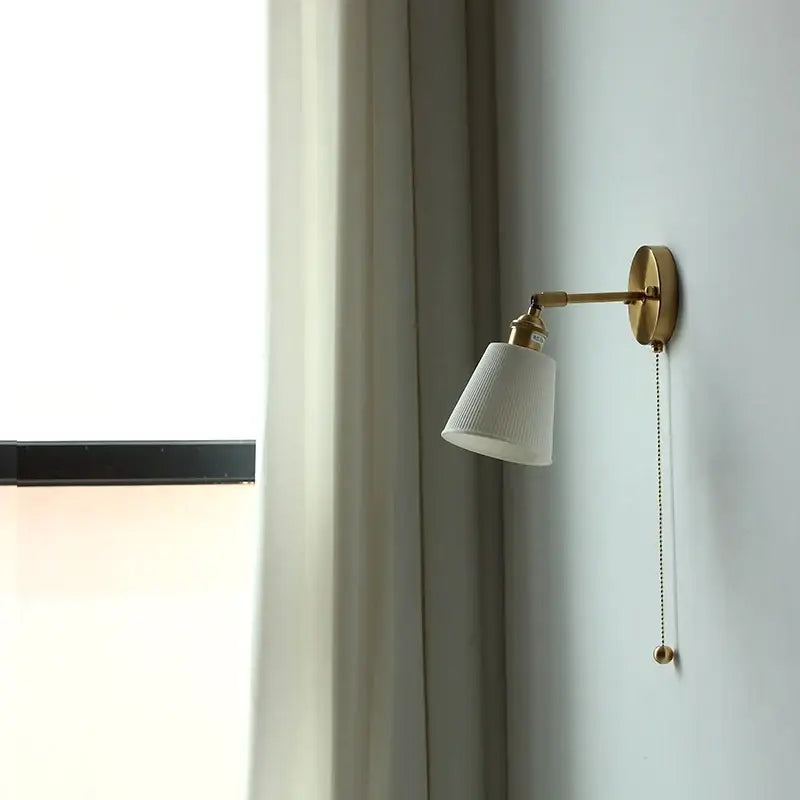 Gold ceramic led wall sconce with ribbed shade for bedroom