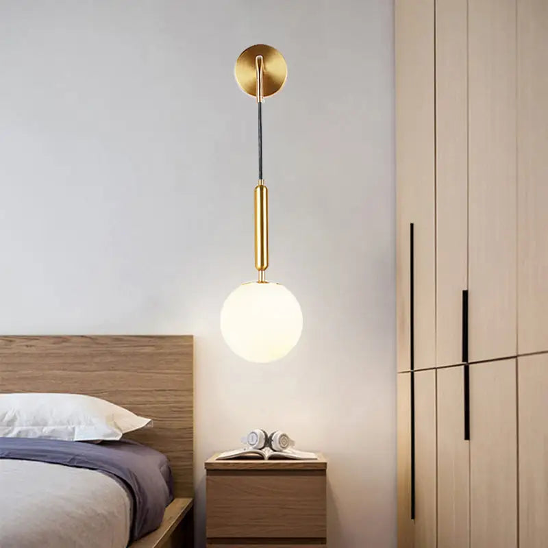 Gold opal glass spherical wall light fixture for bedroom