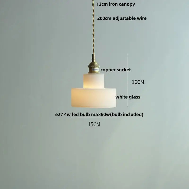 Green glass pendant light with copper canopy for dining room