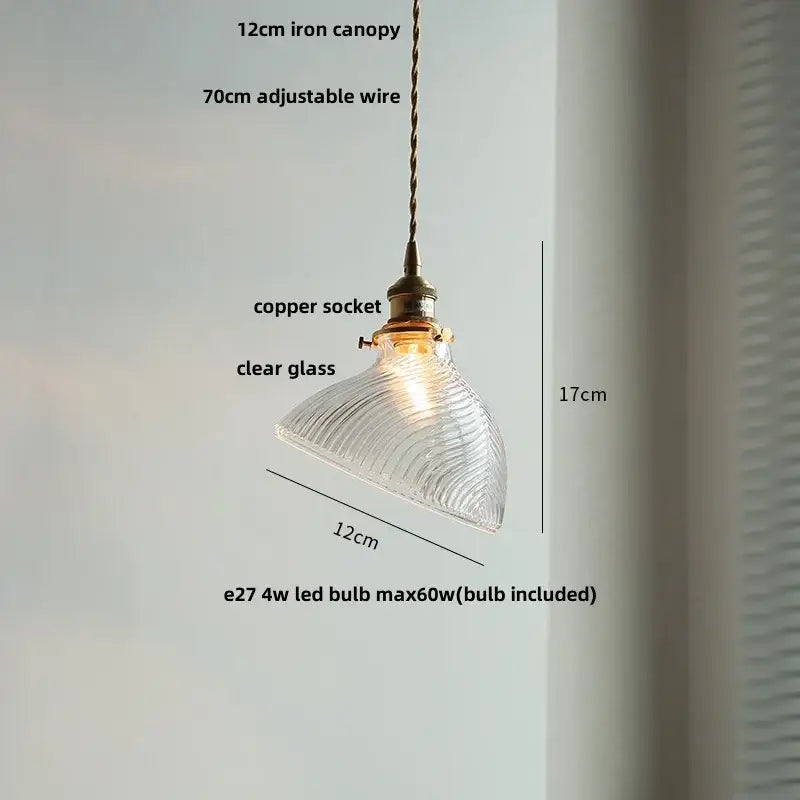 Green glass pendant light with copper canopy for dining room