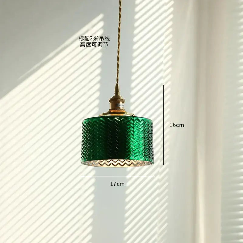 Green glass pendant light with copper canopy for dining room