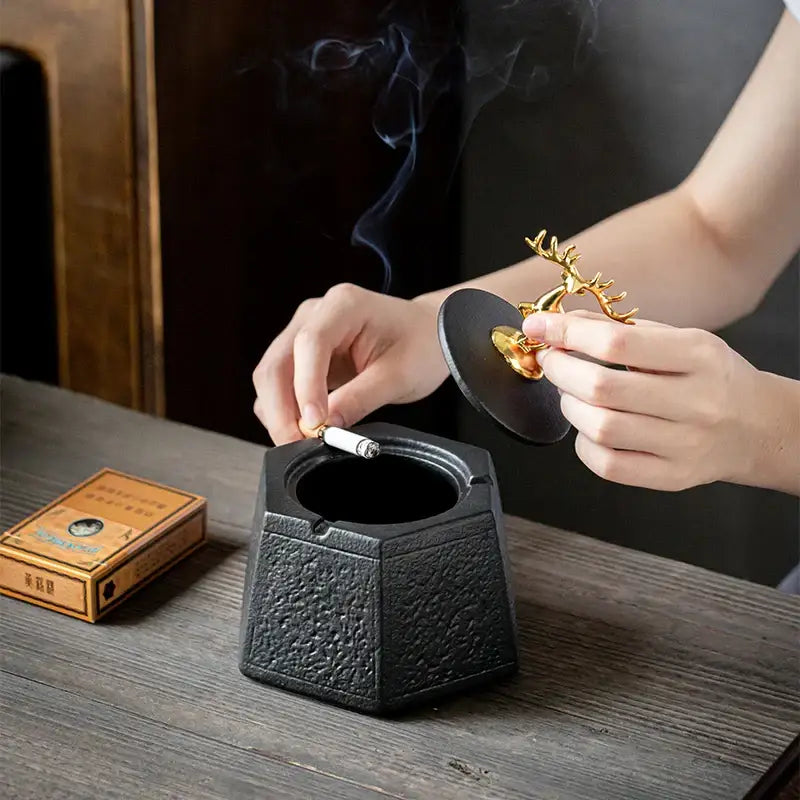 Hexagonal black pottery ashtray with gold deer lid for living room