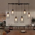 Industrial-style black metal pendant light fixture with five exposed bulb cages in antique style bronze iron for dining room lighting