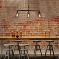 Industrial black cage iron pendant – dining room pipe light
