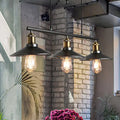 DecorBites™ industrial metal saucer foyer island ceiling light with three black pendant lights and brass accents