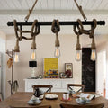Industrial black pipe and rope chandelier for linear restaurant island