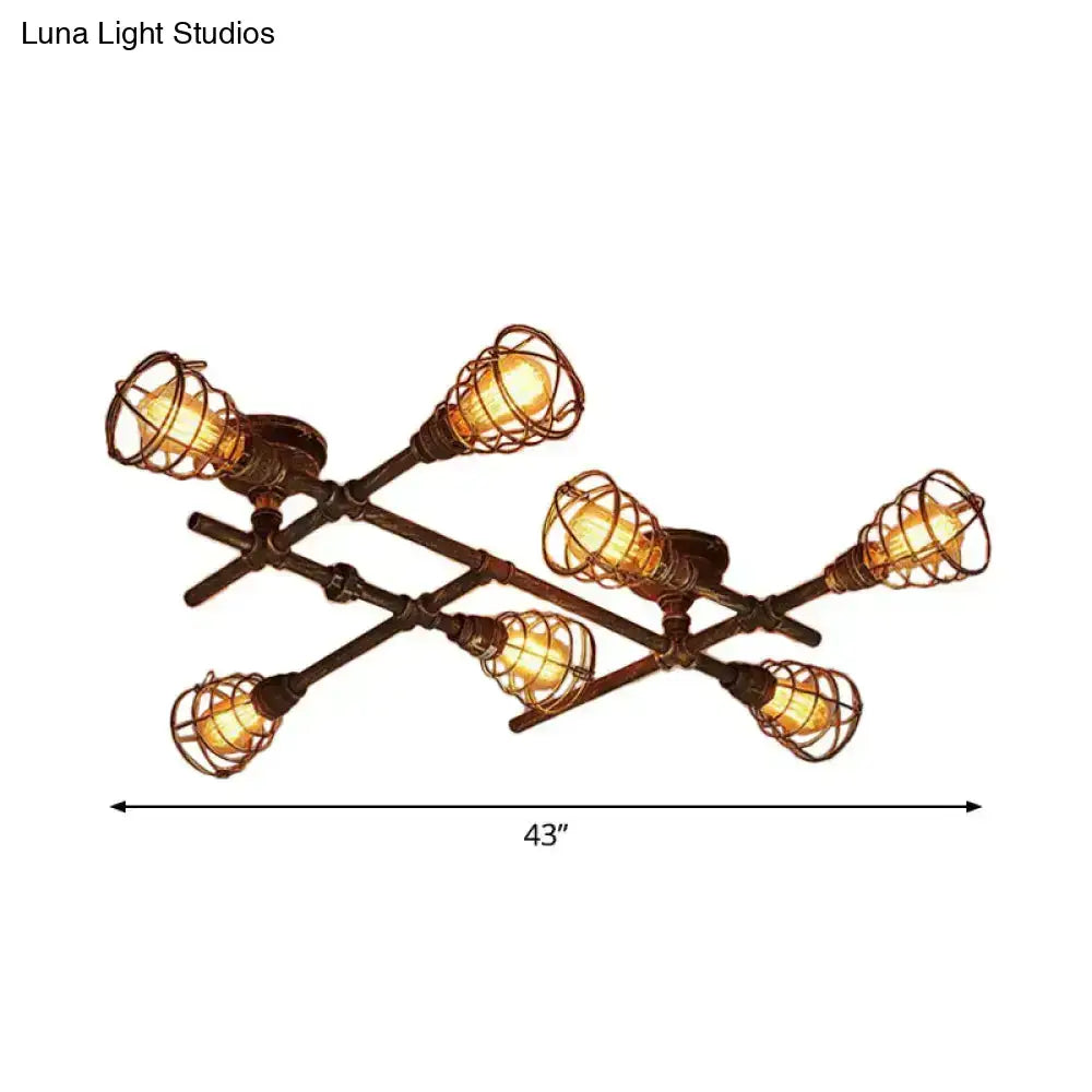 Industrial brass intersecting piping ceiling light with six filament bulbs in dark bronze wire cages for dining room