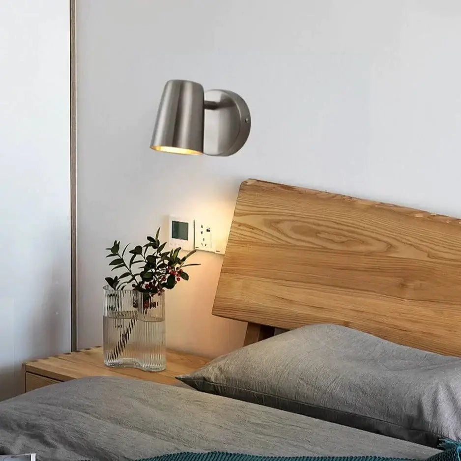 Industrial led wall sconce in brushed stainless steel with cylindrical shade and adjustable arm for bedroom spotlight lighting