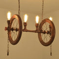 DecorBites™ industrial hanging light kit with vintage bicycle wheels copper pipe fittings and Edison bulbs for dining room island