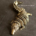 Intricate brass crocodile sculpture living room decor accessory