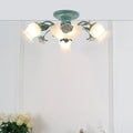 Teal floral ceiling light with frosted glass shades and painted metal arms for bedroom korean garden flower design